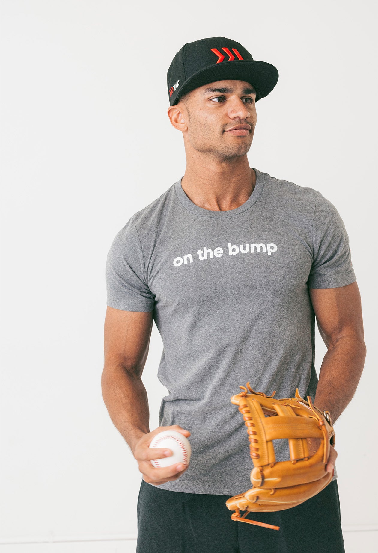 adult-on-the-bump-gray-baseball-tee-on-man