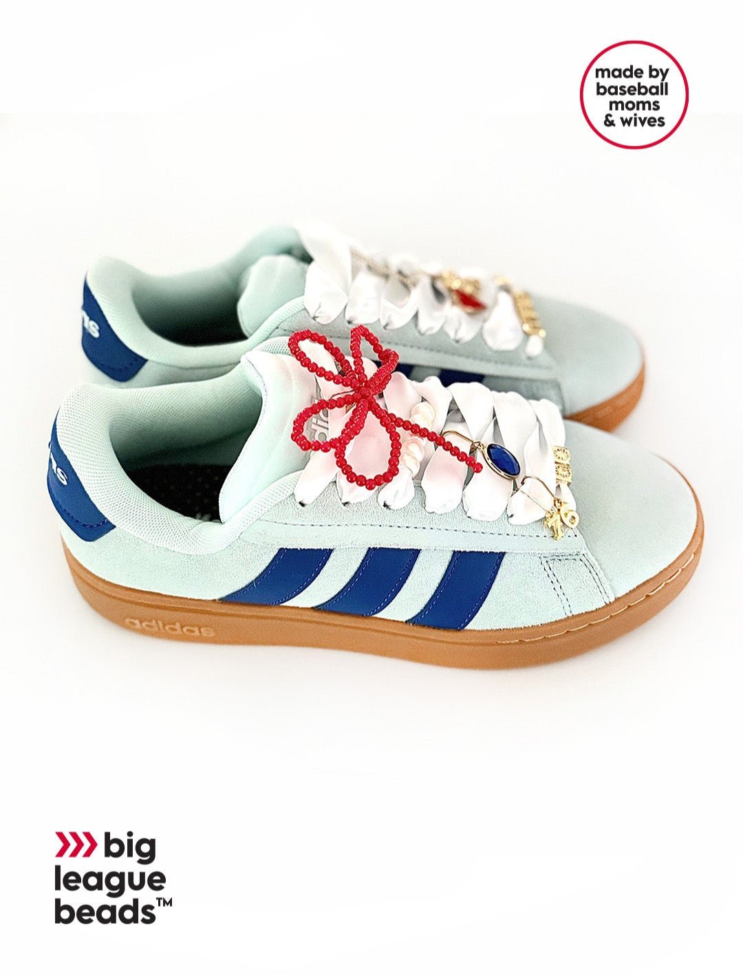 White sneaker with blue stripes and red laces on a white background, featuring 'big league beads' branding.