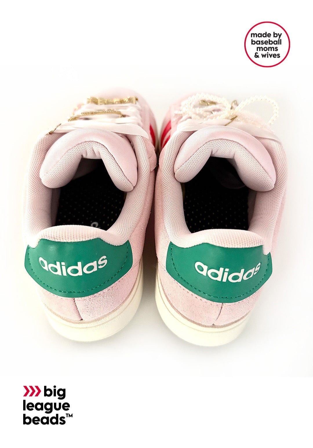 Pink Adidas sneakers with green accents on a white background wiht big league beads logo