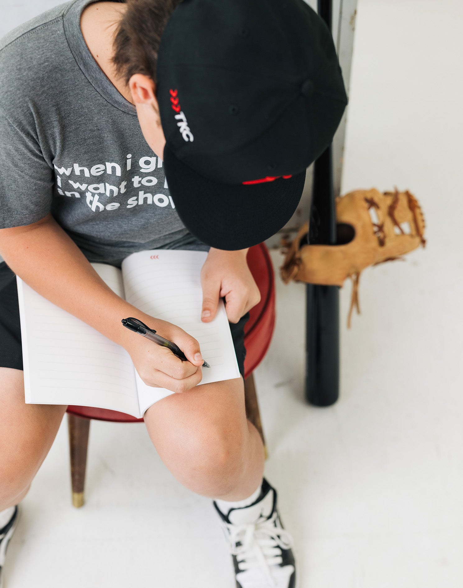 baseball-notebook-kid-writing