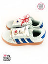 White sneakers with blue stripes and red laces on a white background, featuring 'big league beads' branding.